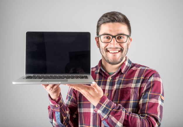 Man with laptop showing screeen