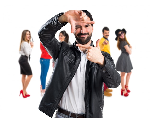 Man with leather jacket focusing with his fingers