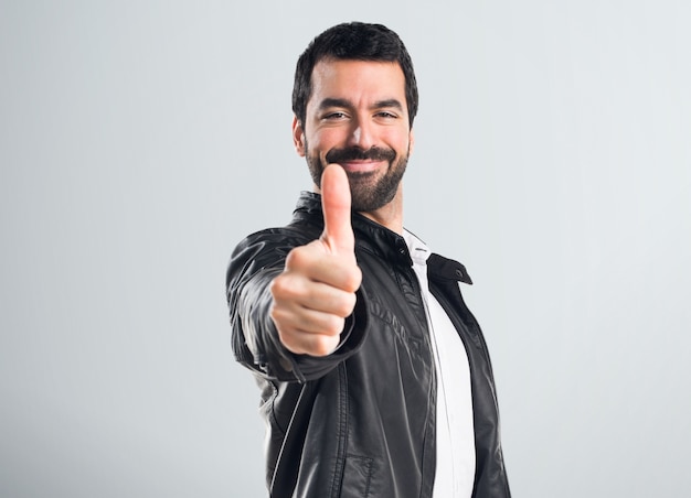 Man with leather jacket with thumb up