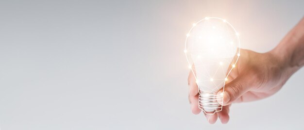 man with a light bulb graphics in his hand and the other side holds white stock graphics