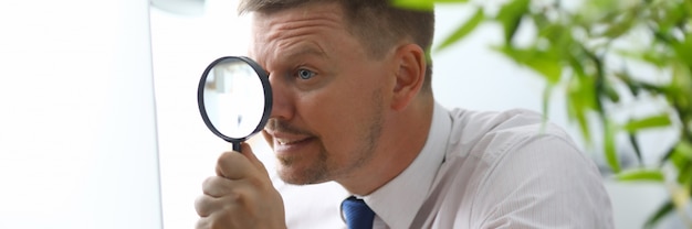 Man with magnifying glass