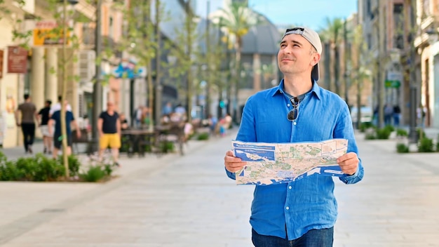 Man with a map on a street in Alicante