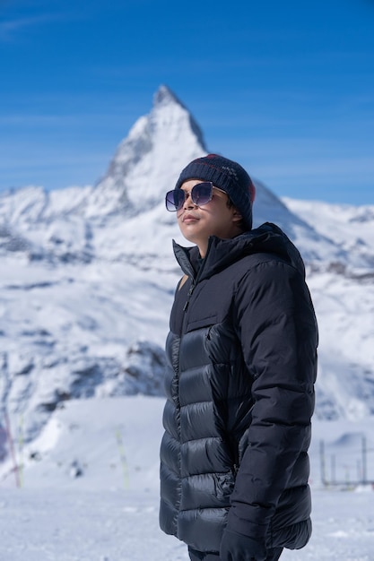 Man with Matterhorn mountain in the Morning Zermatt Switzerland