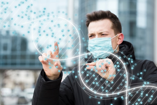 Photo man with medical mask looking at dna structure