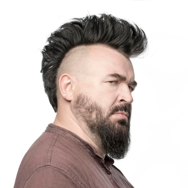 A man with a mohawk and beard isolated