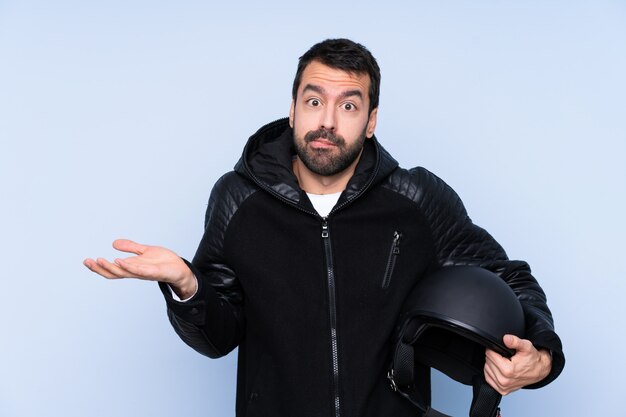 Man with a motorcycle helmet having doubts while raising hands