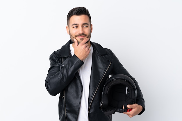 Man with a motorcycle helmet thinking an idea