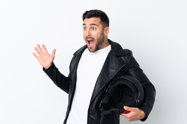 Man with a motorcycle helmet with surprise facial expression