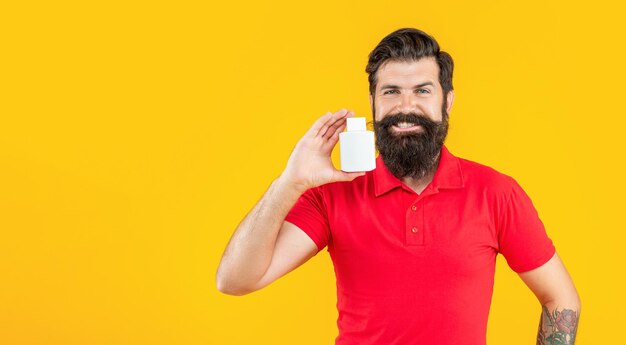 Man with multivitamins on background banner photo of man with multivitamins jar