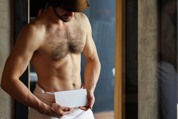 Photo man with naked torso shows white empty flyer