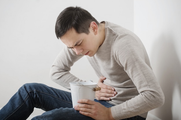 A man with nausea on floor