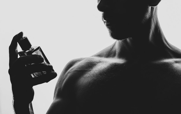 Man with perfume on black and white