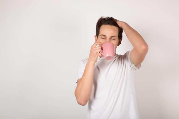 Man with pink cup on white