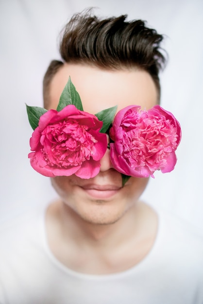 Man with pink peonies on his eyes