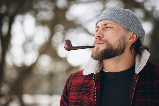 Man with pipe outside