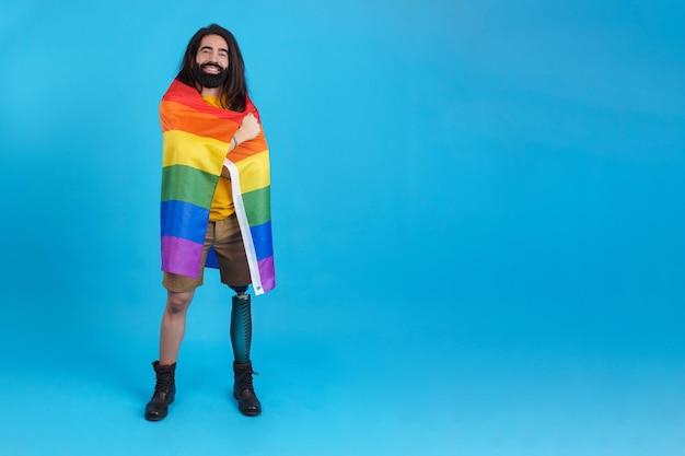 Man with a prosthetic leg wrapped in a lgbt flag