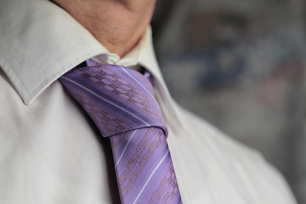 A man with a purple tie