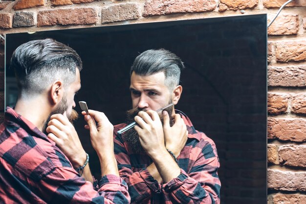 Man with razor near mirror