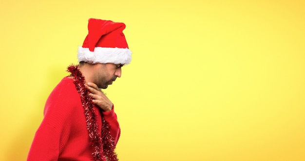 Man with red clothes celebrating the Christmas holidays is suffering with cough
