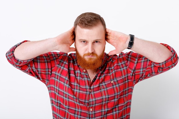 Man with red hair and beard in plaid shirt