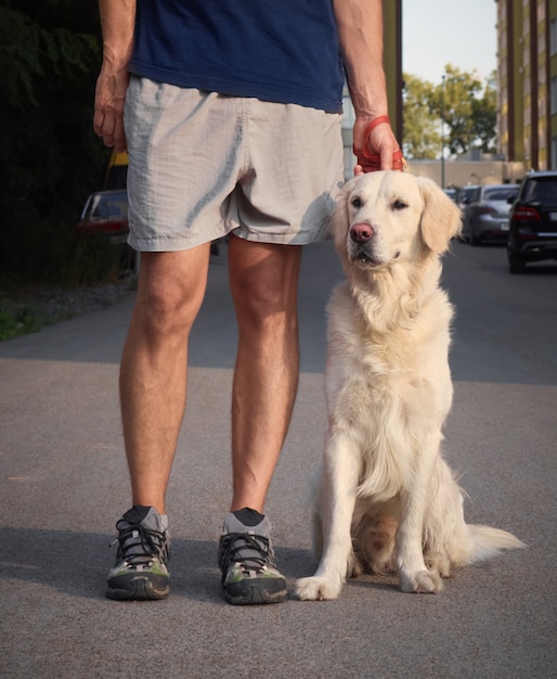 Man with a retriever.