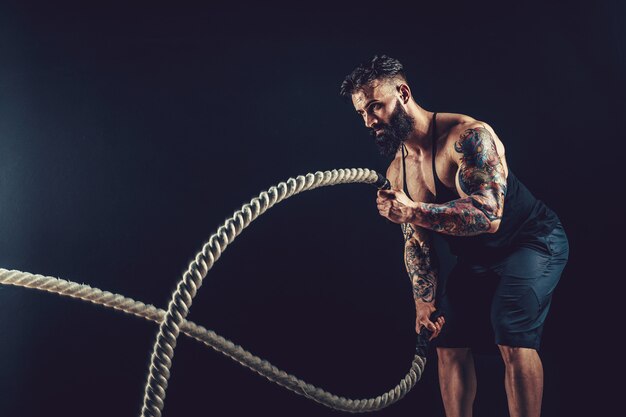 Man with rope in functional training