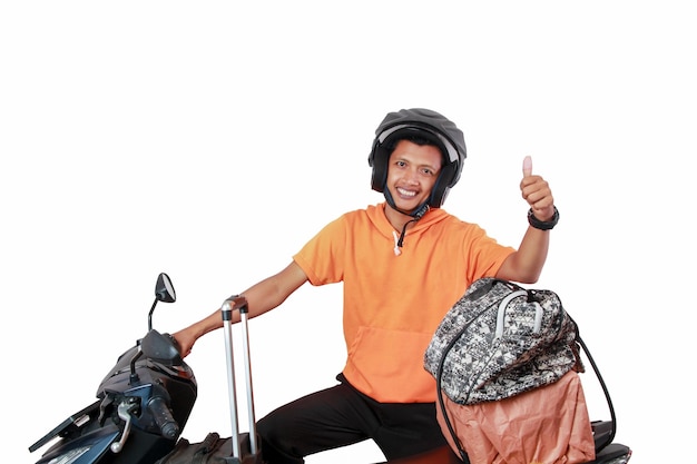 A man with a scooter and a bag of luggage