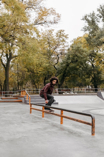 Man with skateboard outside