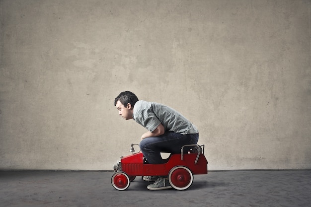 man with a small car