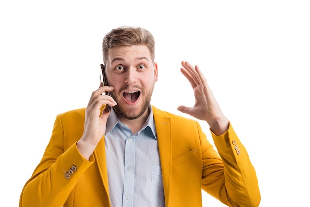 Man with smartphone expressing surprise