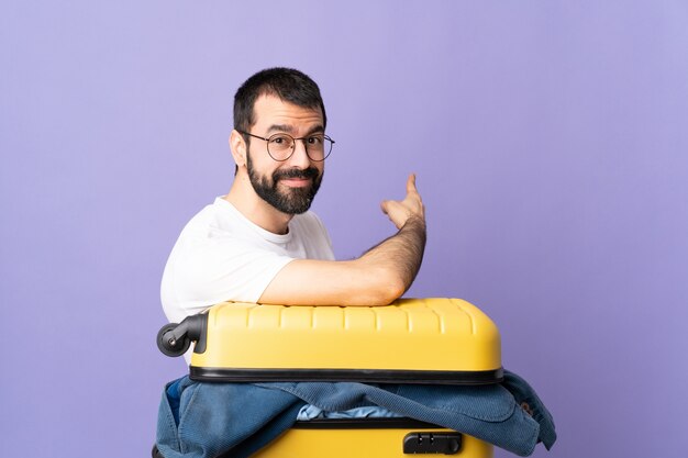 Man with a suitcase in studio