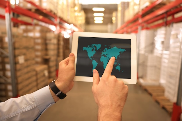 Man with tablet at warehouse closeup Wholesale business