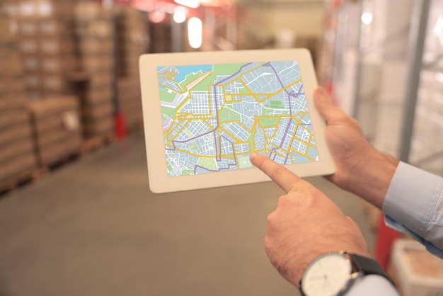 Man with tablet at warehouse closeup Wholesale business