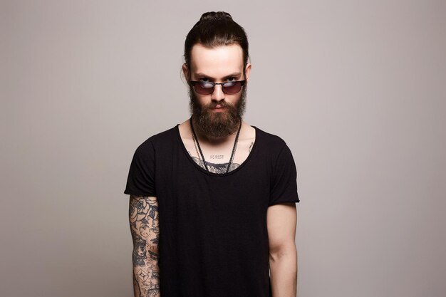 Man with tattoo and sunglasses