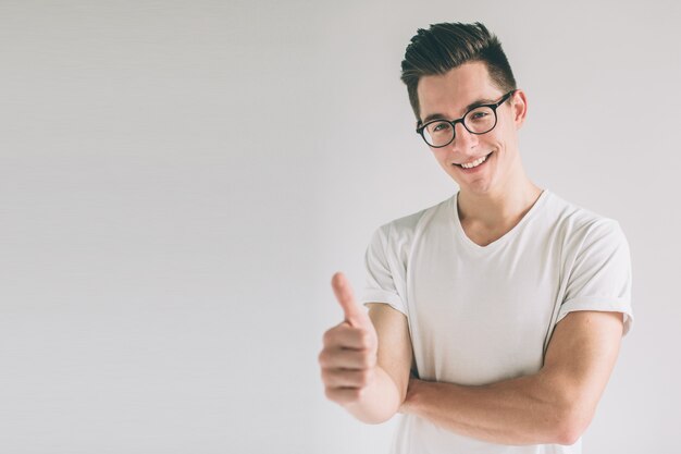 Man with thumbs up isolated over light background