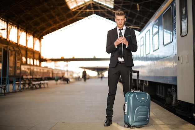 man with trolley in train station