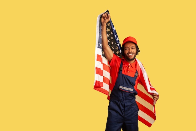 man with usa flag shouting and smiling celebrating labor day