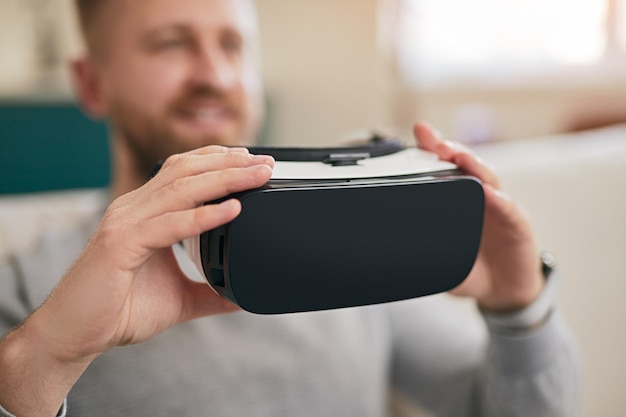 Man with vr goggles at home