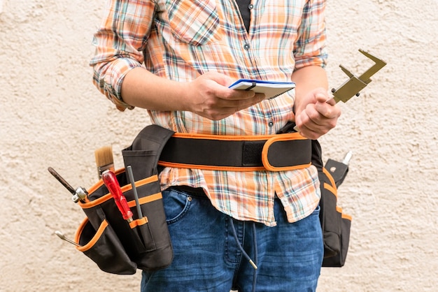 man with waist belt with tools