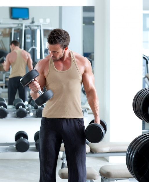  man with weight training equipment on sport gym