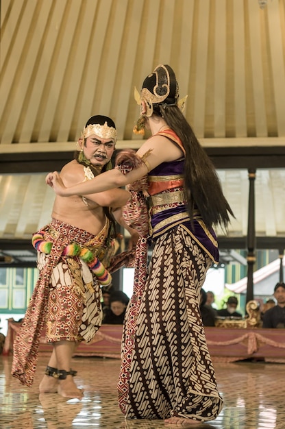 A man and a woman are dancing in a dance.