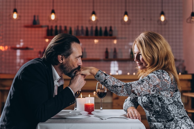 Man and woman are dining in a restaurant