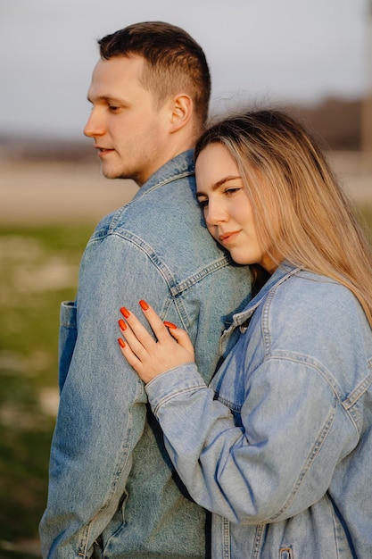 A man and a woman are hugging each other.