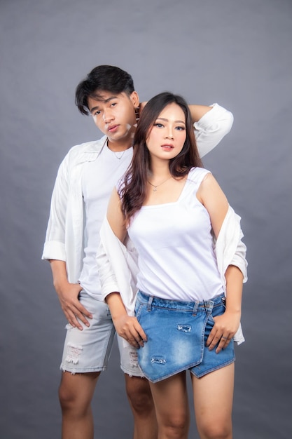 A man and a woman are posing for a photo male and female promo fashion couple casual prewedding