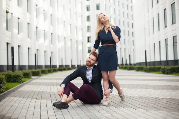 Man and woman on the background on white office building