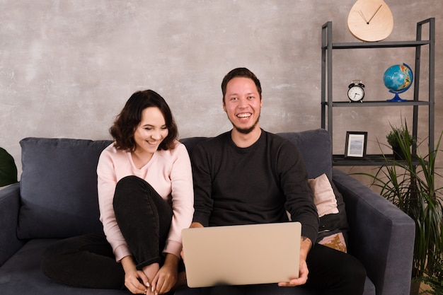 Man and woman being happy to buy online