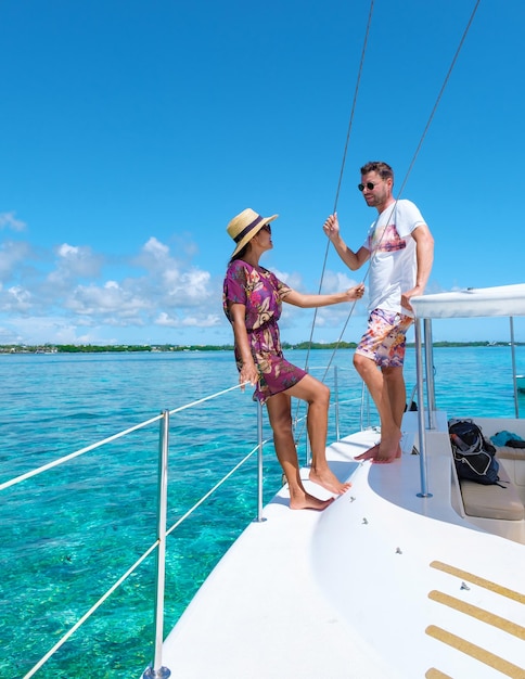 Man and woman on a boat trip at a sailing boat in mauritius