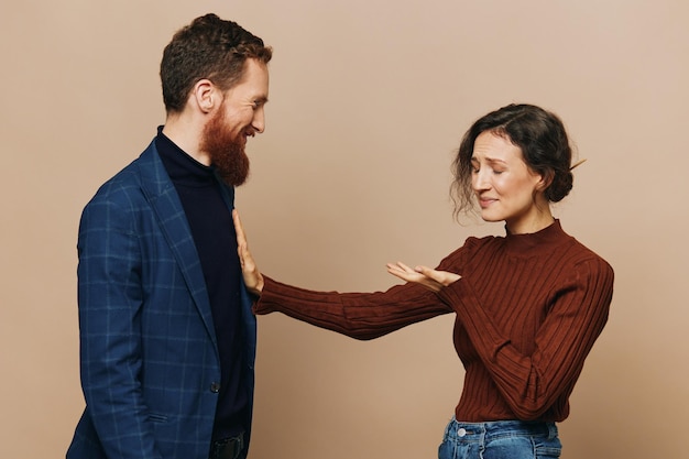 man and woman couple in a relationship quarrel yelling psychological violence in the family problems in a real relationship between people