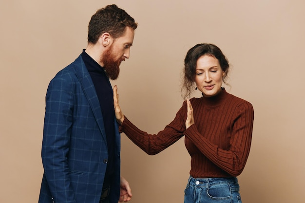 man and woman couple in a relationship quarrel yelling psychological violence in the family problems in a real relationship between people
