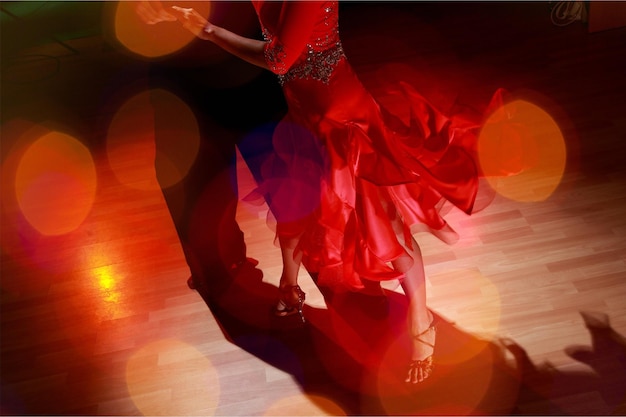 Man and a woman dancing salsa on background